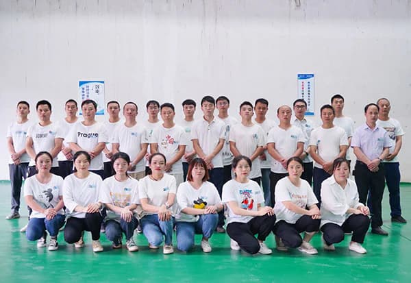 Authorized source-context group photograph of an equipment organization team